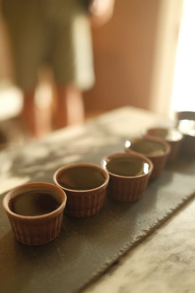 Traditional Portuguese ginja liqueur served in chocolate cups, a popular local specialty enjoyed throughout Portugal.
