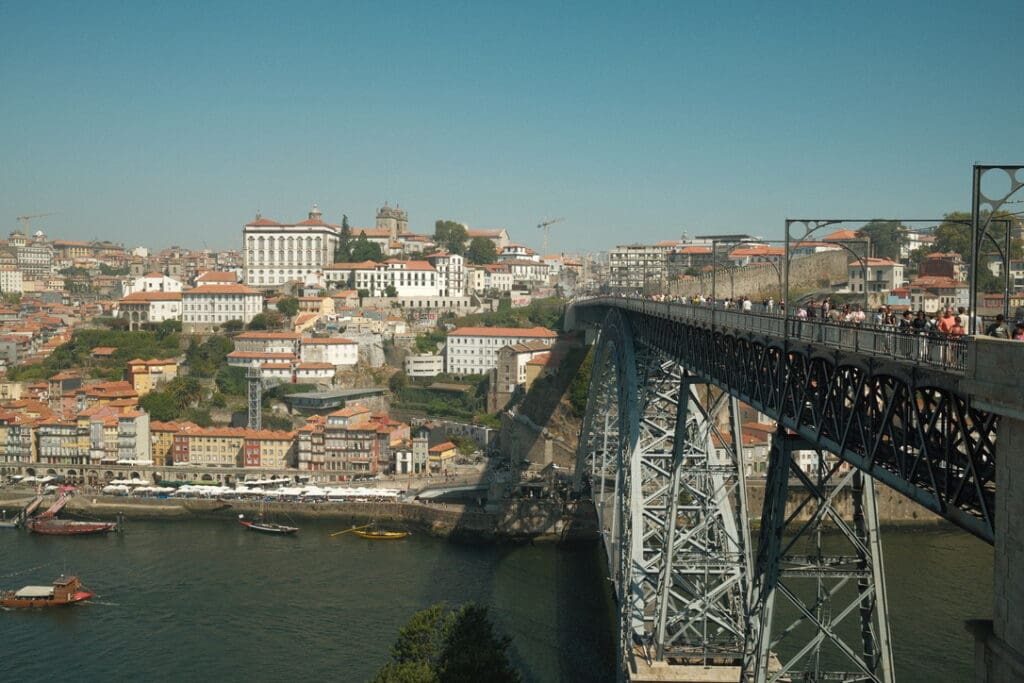 View of Porto, Portugal, with the iconic Dom Luís I Bridge spanning the Douro River.