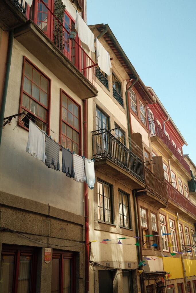 Traditional Portuguese buildings lining a narrow street in Porto, Portugal