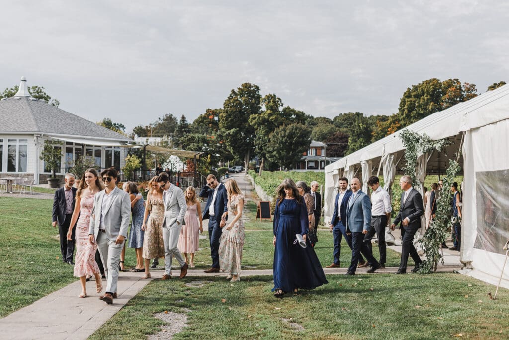 Wedding guests arriving for the waterfront ceremony at Waupoos Estates Winery